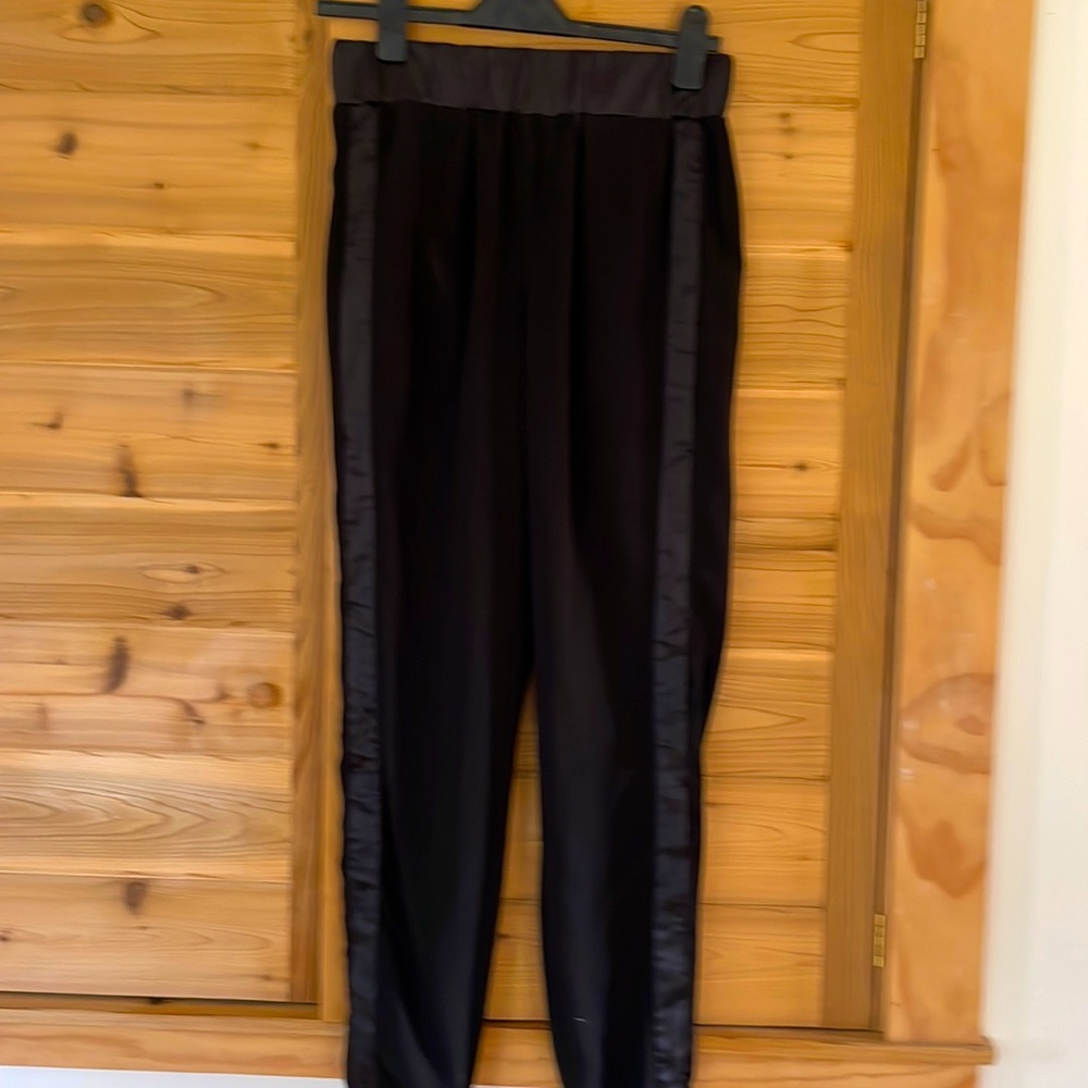 Dressy jogger type pants, elastic around waist and ankles, trimmed in satin